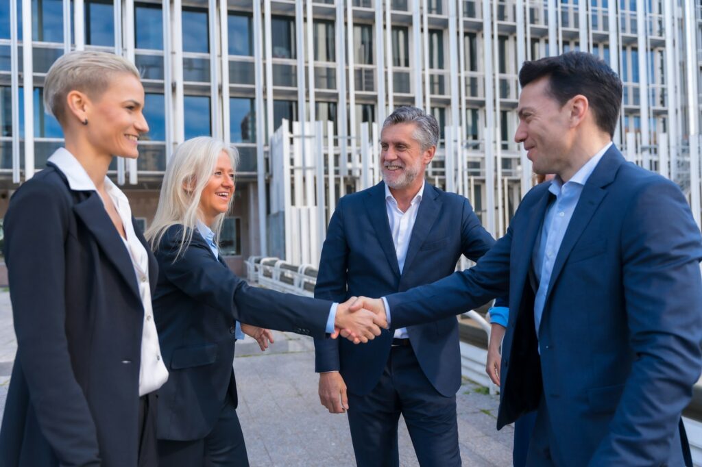 Executives Exchanging Greetings in Commercial Center